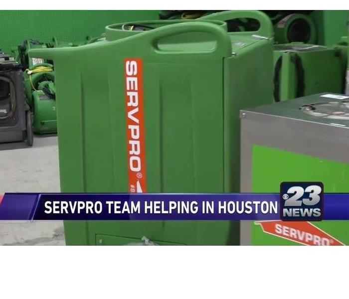news frame of green servpro dehumidifiers